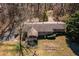 Aerial view of home showcasing large lot, backyard play area, and mature trees at 1537 David Lee St, Acworth, GA 30102