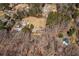 Wide aerial shot displaying a property amid wooded surroundings and neighboring homes, highlighting its privacy at 1537 David Lee St, Acworth, GA 30102