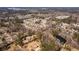 Expansive aerial view of a residential area featuring lush landscapes and a serene lake at 1537 David Lee St, Acworth, GA 30102