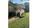 Back porch with steps leading to a well-manicured yard and a covered area with ceiling fan at 1537 David Lee St, Acworth, GA 30102