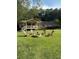 Relaxing backyard with fire pit and Adirondack chairs, ideal for entertaining guests at 1537 David Lee St, Acworth, GA 30102
