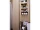 This bathroom is nicely decorated with floating shelves and towels in a basket, maximizing space and charm at 1537 David Lee St, Acworth, GA 30102