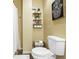 Half bath with a sleek vanity, decorative mirror, modern fixtures, and neutral color palette at 1537 David Lee St, Acworth, GA 30102