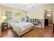 Bright bedroom featuring hardwood floors, two windows, and a light neutral color palette at 1537 David Lee St, Acworth, GA 30102