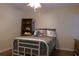 This bedroom offers a cozy space with a light ceiling fan and a bookshelf for decor at 1537 David Lee St, Acworth, GA 30102