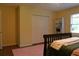 This bedroom features a cozy rug, plenty of natural light and a large closet for ample storage at 1537 David Lee St, Acworth, GA 30102
