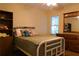 Cozy bedroom with a white frame bed, ceiling fan, dresser, and a window with natural light at 1537 David Lee St, Acworth, GA 30102