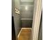 Walk-in closet with gray walls, wood floors, white trim, and white wire shelving at 1537 David Lee St, Acworth, GA 30102