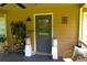 Inviting front porch with beautiful potted plants and decor offering a warm welcome at 1537 David Lee St, Acworth, GA 30102