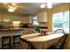 Cozy kitchen and dining room featuring white cabinets, black countertops, and ample natural light at 1537 David Lee St, Acworth, GA 30102