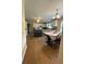 Open-concept kitchen with an island, white cabinetry, and a dining table at 1537 David Lee St, Acworth, GA 30102