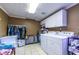 Functional laundry room features tile floors, ample storage, and a convenient layout for easy laundry tasks at 1537 David Lee St, Acworth, GA 30102