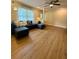 Inviting living room featuring luxury flooring and a comfortable couch, perfect for relaxation at 1537 David Lee St, Acworth, GA 30102