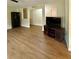 This living room offers plenty of natural light, hard wood floors, and ample space for entertaining guests at 1537 David Lee St, Acworth, GA 30102