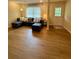Comfortable living room featuring new hardwood floors, a cozy couch, and lots of natural light at 1537 David Lee St, Acworth, GA 30102