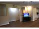 Open-concept living room with hard floors, ceiling fan, and television at 1537 David Lee St, Acworth, GA 30102