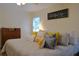 Comfortable main bedroom featuring a decorative sign and plenty of natural light from the window at 1537 David Lee St, Acworth, GA 30102