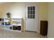 Functional mud room with tiled floor, exterior door, and shelving for storage at 1537 David Lee St, Acworth, GA 30102