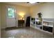 Well-lit mud room featuring tile floors, an exterior door, and built-in storage shelves at 1537 David Lee St, Acworth, GA 30102