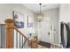 Stylish foyer features wood staircase, gray walls and decorative lighting at 1820 N Creek Cir, Alpharetta, GA 30009