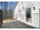 Backyard patio with stone accents and a wooden fence at 185 Bellehaven Dr, Woodstock, GA 30188