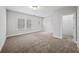 Spacious bedroom with natural light from two windows and a walk in closet at 185 Bellehaven Dr, Woodstock, GA 30188