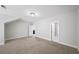 Bedroom featuring neutral walls and carpet, with a view into the hall and living area at 185 Bellehaven Dr, Woodstock, GA 30188