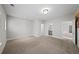 Large bedroom with multiple doorways and neutral carpeting at 185 Bellehaven Dr, Woodstock, GA 30188