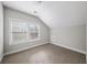 Loft bedroom with carpet flooring and window views at 185 Bellehaven Dr, Woodstock, GA 30188
