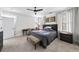 Comfortable bedroom with a ceiling fan, a desk, and large windows offering ample natural light at 185 Bellehaven Dr, Woodstock, GA 30188