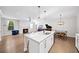 Bright kitchen offers white cabinets, stainless steel appliances, and an open layout with a fireplace view at 185 Bellehaven Dr, Woodstock, GA 30188