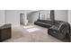 Spacious living room with neutral carpet and a large sectional sofa at 185 Bellehaven Dr, Woodstock, GA 30188