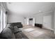Spacious living room featuring carpet floors, neutral walls, and a large sectional sofa at 185 Bellehaven Dr, Woodstock, GA 30188