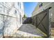 Concrete patio area with a wooden fence at 185 Bellehaven Dr, Woodstock, GA 30188