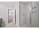 Tiled shower stall with built-in shelving offers a modern and clean aesthetic at 185 Bellehaven Dr, Woodstock, GA 30188