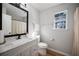 Bright bathroom with a sleek vanity, updated fixtures, and natural light from the window at 2524 Columbia Crossing Ct, Decatur, GA 30034