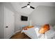 Bright, cozy bedroom with a ceiling fan and a view of the television at 2524 Columbia Crossing Ct, Decatur, GA 30034