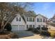 Traditional two-story home with a two-car garage and manicured landscaping at 2524 Columbia Crossing Ct, Decatur, GA 30034