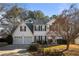 Charming two-story home with a well-maintained lawn and traditional architectural details at 2524 Columbia Crossing Ct, Decatur, GA 30034
