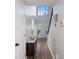 Bright foyer with hardwood floors, staircase, and elegant lighting fixtures at 2524 Columbia Crossing Ct, Decatur, GA 30034