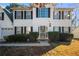 Welcoming front entrance with a decorative door, security gate, and trimmed bushes at 2524 Columbia Crossing Ct, Decatur, GA 30034