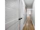 Hallway featuring closet space and attractive laminate flooring at 2524 Columbia Crossing Ct, Decatur, GA 30034