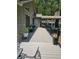 Spacious back deck with outdoor seating, lush greenery, and a welcoming entrance to the home at 1655 Butler Bridge Rd, Covington, GA 30016