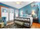 Serene bedroom with stylish décor, a comfortable bed, and natural light from the door and window at 1655 Butler Bridge Rd, Covington, GA 30016