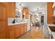 Bright kitchen with wooden cabinets, white countertops, and a cozy breakfast nook near the windows at 1655 Butler Bridge Rd, Covington, GA 30016