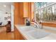 Charming kitchen with custom cabinetry and a large window with scenic views at 1655 Butler Bridge Rd, Covington, GA 30016