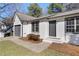 A charming home featuring a well-kept lawn and an attached single car garage at 2070 Charles Cudd Ct, Lithonia, GA 30058