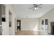 Bright living room with vaulted ceiling, neutral paint, fireplace and sliding door at 2070 Charles Cudd Ct, Lithonia, GA 30058