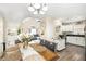 Open concept dining area leading to the kitchen and living room with plenty of natural light at 7760 Poppy Dr, Winston, GA 30187