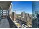 A scenic view of the city from the balcony with high-rise buildings in the distance at 1080 Peachtree Ne St # 2003, Atlanta, GA 30309